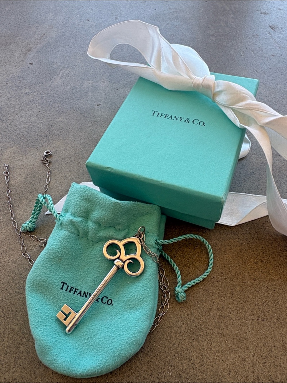 Tiffany & Co. Fleur de Lis Key Pendant Necklace with box, pouch and bow